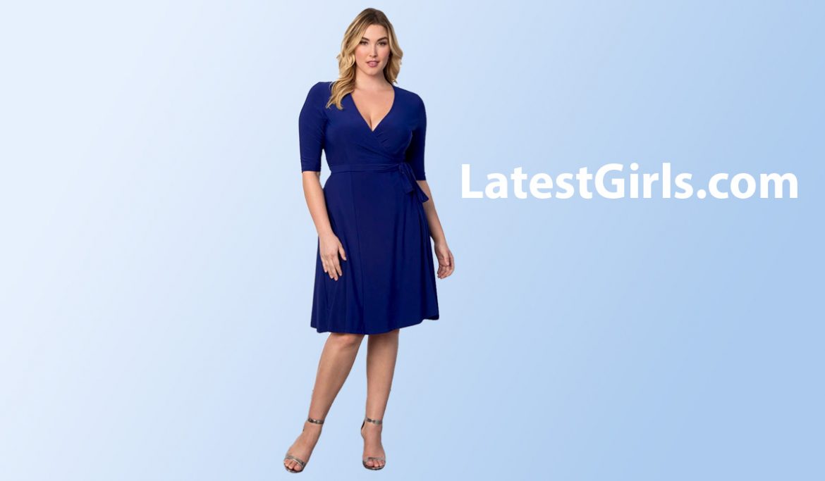 a woman wearing a blue color wrap dress
