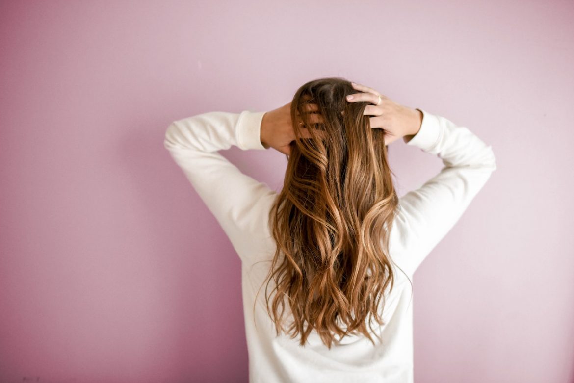 woman holding her hair in her hands